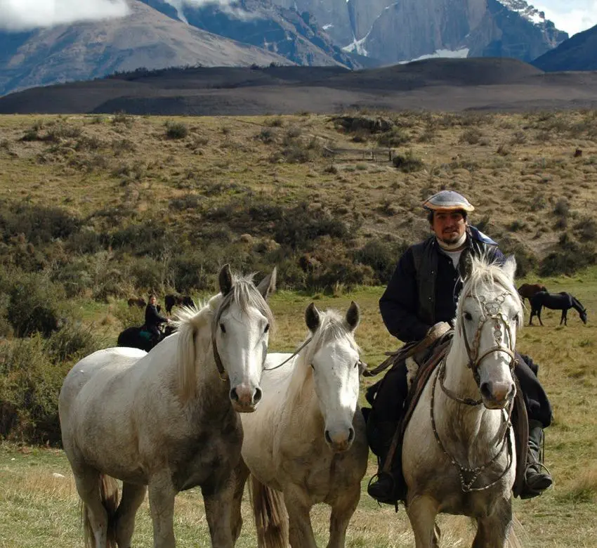 Glacier Camping- your baqueanos tend to the horses on this riding trek in Chile