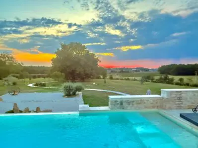 Sunset beyond the pool at the comfortable Bed and Breakfast in the French countryside