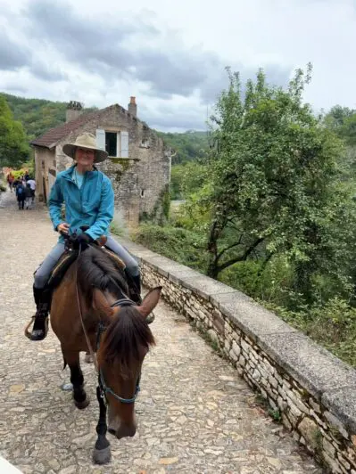 Riding through a town on horseback