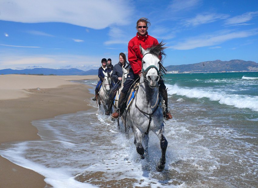 Horseback riding on the beach in Spain